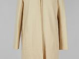 a beige wool coat on a mannequin mannequin mannequin mannequin mannequin mannequin mannequin mannequin manne