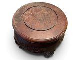 an old wooden box with a carved design on the top