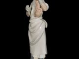 a figurine of a woman holding a baby