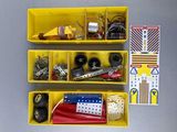 two yellow bins filled with different types of sewing supplies