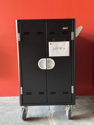 two black lockers sitting next to each other in a room
