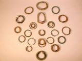 many rings that are arranged in a circle on a table