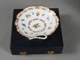 a close up of a plate on a box with a handle