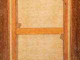 an old wooden window with a wooden frame and a window pane in it