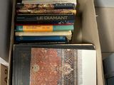 a box full of books sitting on the floor