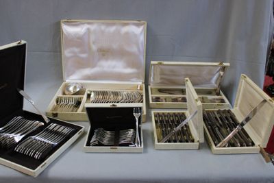 a table with a bunch of silverware on it