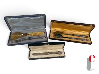 four different types of silverware in a case on a white surface