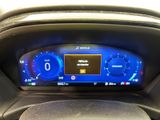 the dashboard of a car with a digital display on it