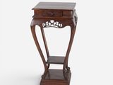 an old wooden table with a drawer on top of it