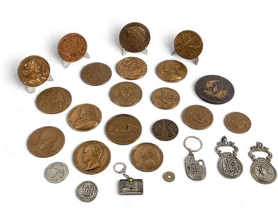 a lot of coins that are on a white surface