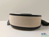 an image of a white and black speaker sitting on top of a table
