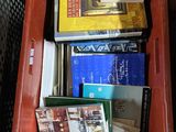 a red box filled with books on top of a table