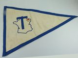 a close up of a pennant with a cross on it