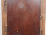 an old wooden picture frame with a brown stain on it