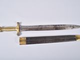 pair of two old and worn knives on a white surface
