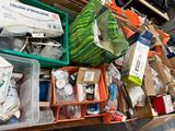 many boxes of assorted items sitting on a shelf