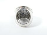 sterling silver ring with filigree design on a white background