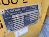 a close up of a sign on the side of a yellow machine