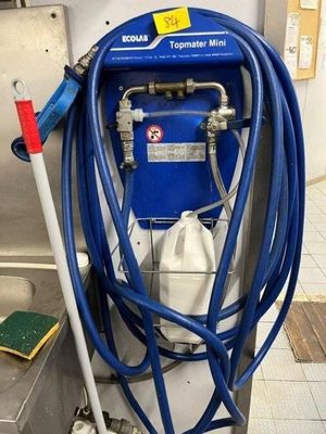 a blue hose attached to a blue machine in a kitchen