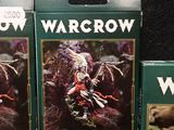 three boxes of wargrow miniatures sit on a table