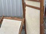 two chairs and a chair that are sitting on the ground