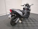 a picture of a motorcycle parked in a garage