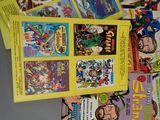 a lot of comic books that are on the table