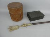 a wooden box, a brush, and a box on a table