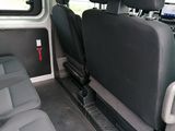 the interior of a van with two rows of seats in it