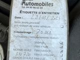 a close up of a car ' s engine with a note attached to it