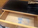 a wooden dresser with a mirror on top of it
