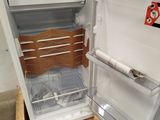 an open refrigerator that is sitting in a room