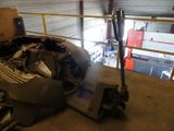 a picture of a car in a garage with the hood up