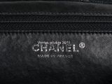 a close up of a black leather bag with a logo on it