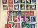 an old book with a bunch of different stamps on it