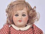 a small doll that is sitting on a table