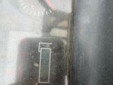 a close up of a clock on the side of a truck