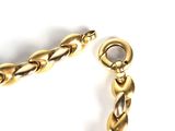 gold plated chain with twisted links on a white background