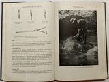 an open book with a picture of a man on a rock
