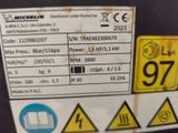 a label on the back of a machine indicating the number of the machine
