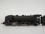 a toy train on a white surface with a white background