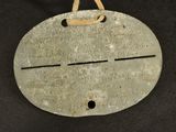 an image of a metal object hanging on a black background