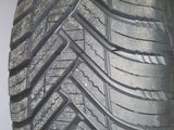 a close up of a tire on a white surface
