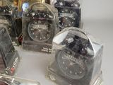 many different types of alarm clocks sitting on a table