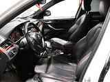a picture of the inside of a car with black leather seats