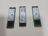 three pci - e modules are sitting on top of a table