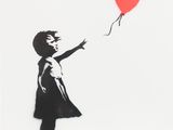 a black and white picture of a girl holding a red balloon