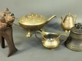 a lot of brass items that are on a table