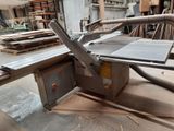 a picture of a table sawing machine in a workshop