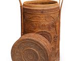 an old wooden basket with a lid and handles on a white background